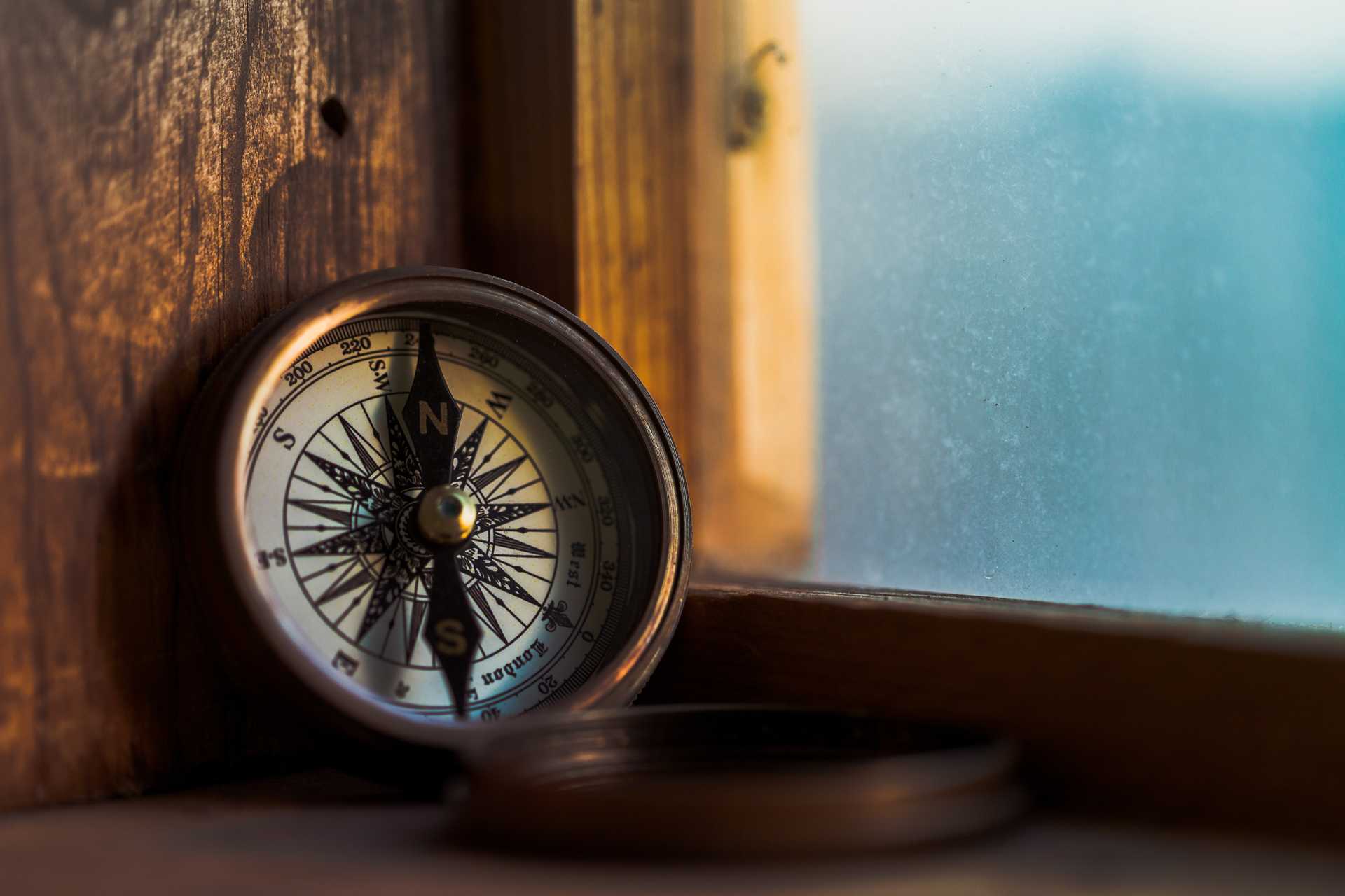 Photo of a compass near a window